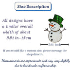 Green hat stained glass snowman decor hanging on glass window for winter home.