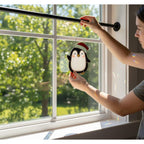 Couple exchanging handmade penguin suncatcher, cute holiday gift idea