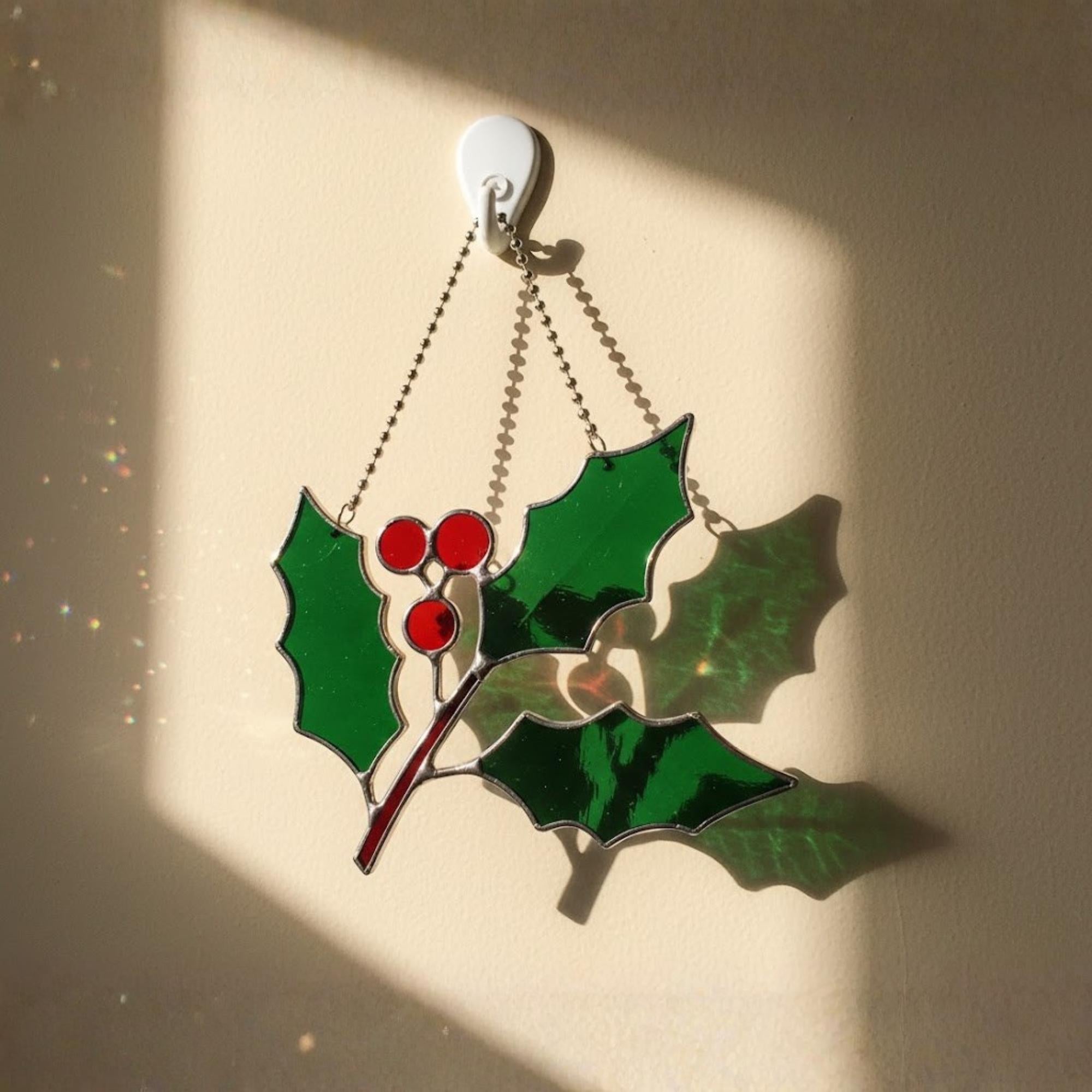 Holly branch stained glass ornament with berries, classic Christmas window décor