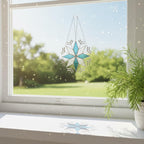Large stained glass snowflake hanging on patio window, sparkling in natural light
