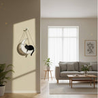 Cat on the moon stained glass suncatcher in outdoor sunlight, magical decor