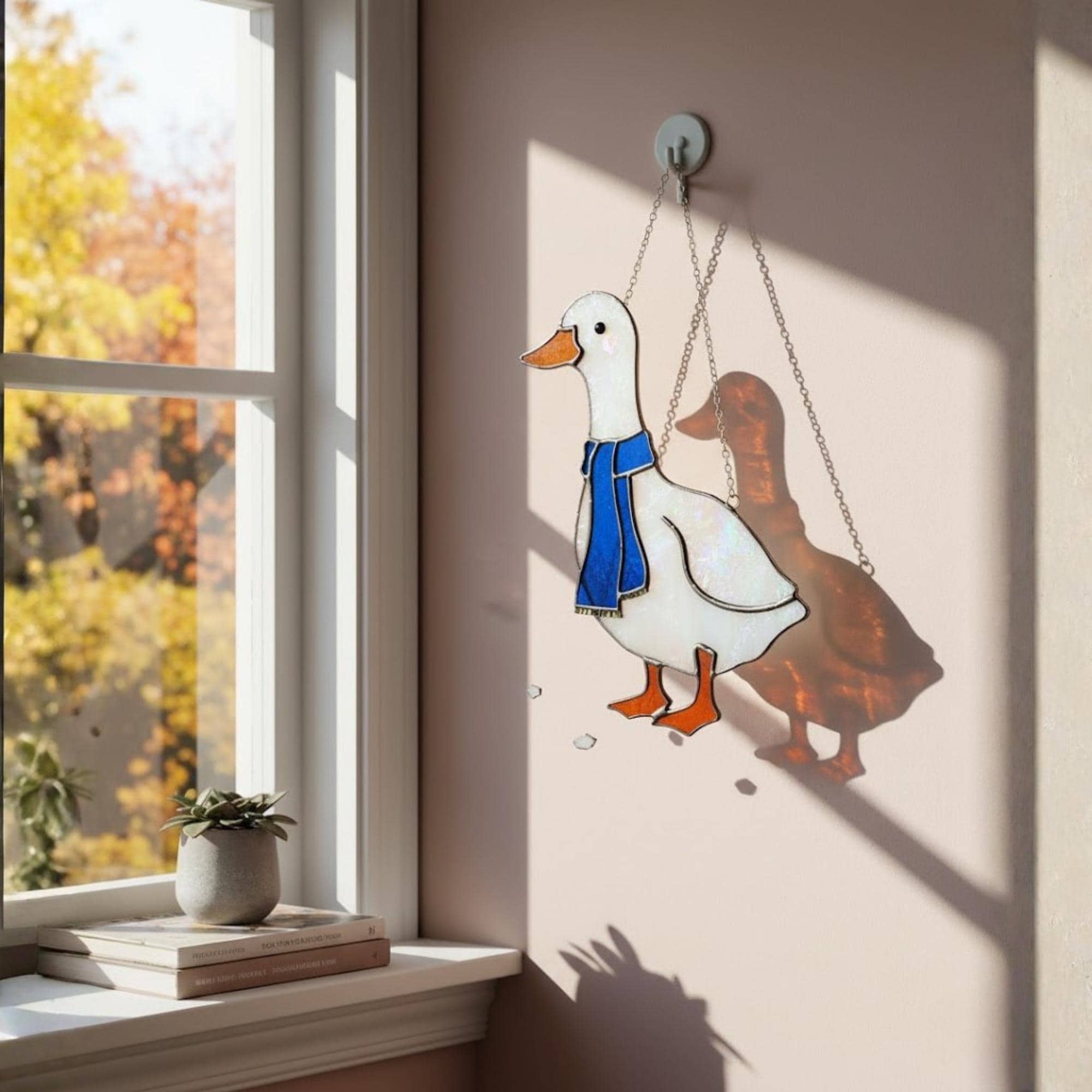 Handmade stained glass goose suncatcher hanging on window, cottagecore bird decor