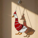 Stylish goose wearing scarf and hat stained glass suncatcher on wall hook