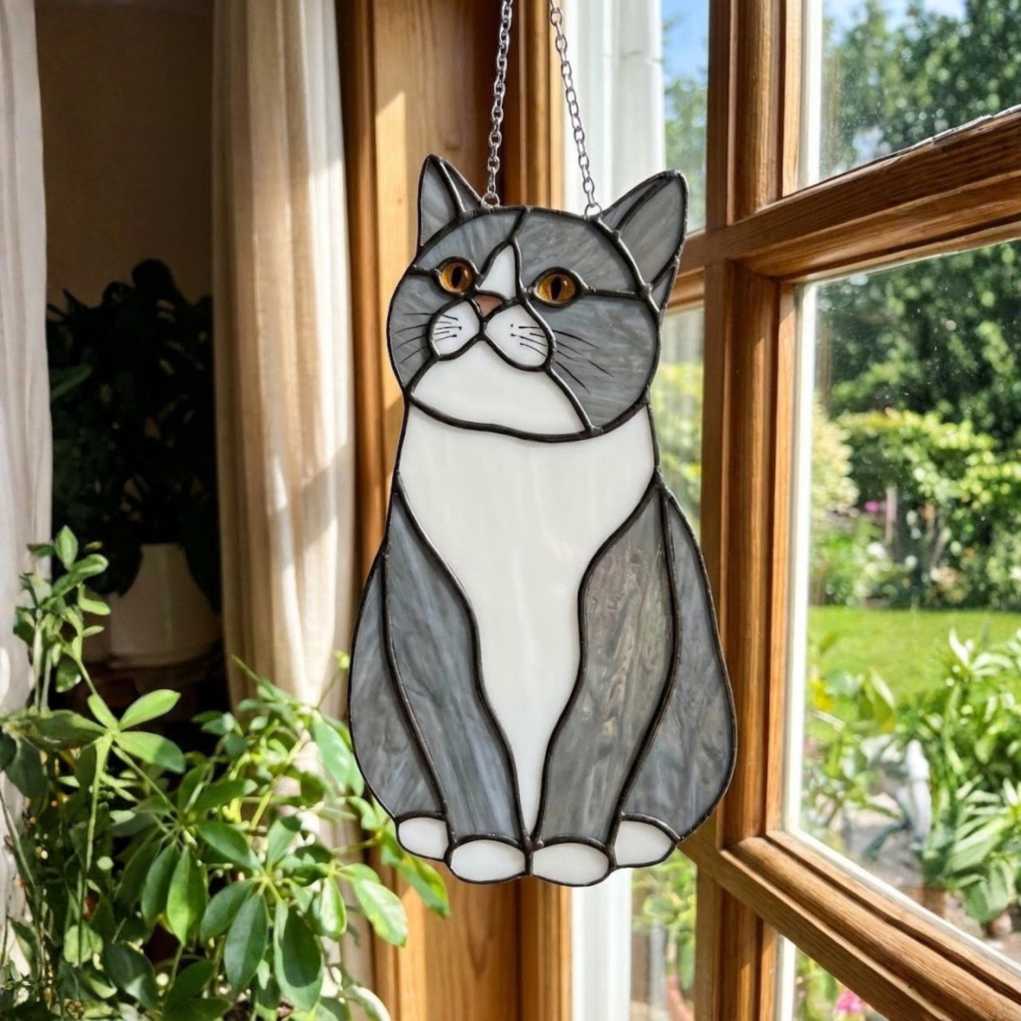Stained glass Tuxedo cat suncatcher in black and white, available in funny lounging and sitting poses, window hanging or wood stand decor.