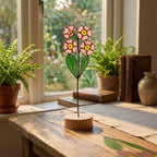 Stained glass pink primrose flower with yellow centers, February birth month gift, available with personalized wood stand or as a single stem.