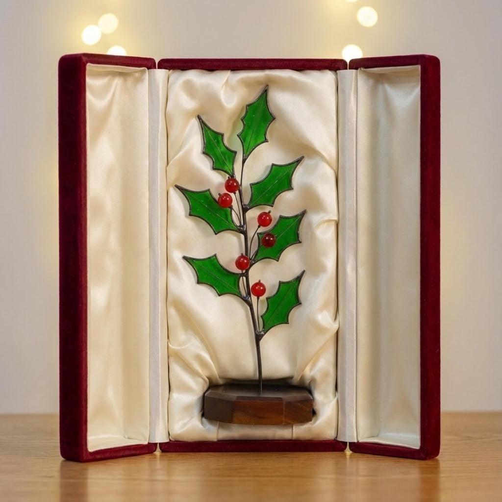 Stained glass holly plant inside a luxury red gift box, secure packaging for Christmas gift.
