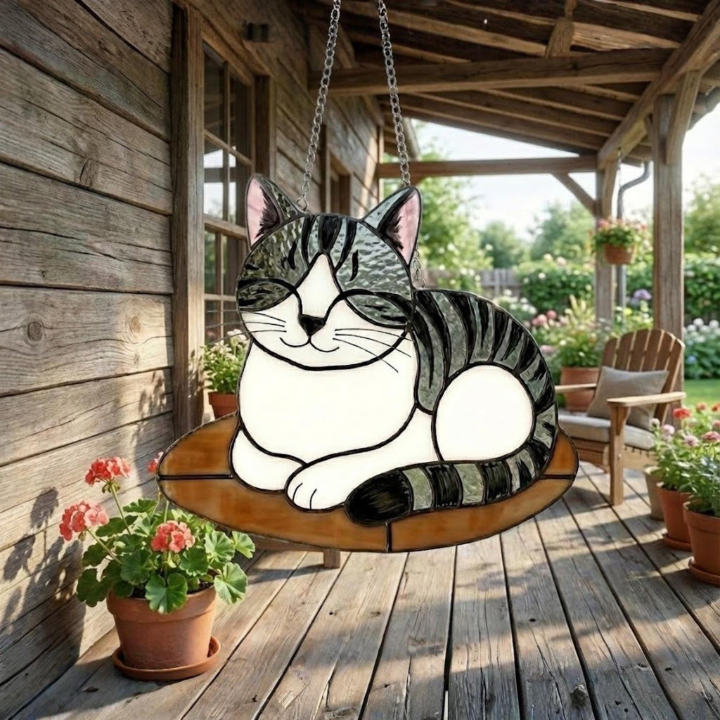 Stained glass grey cat hanging on outdoor wooden porch, garden and patio decor.