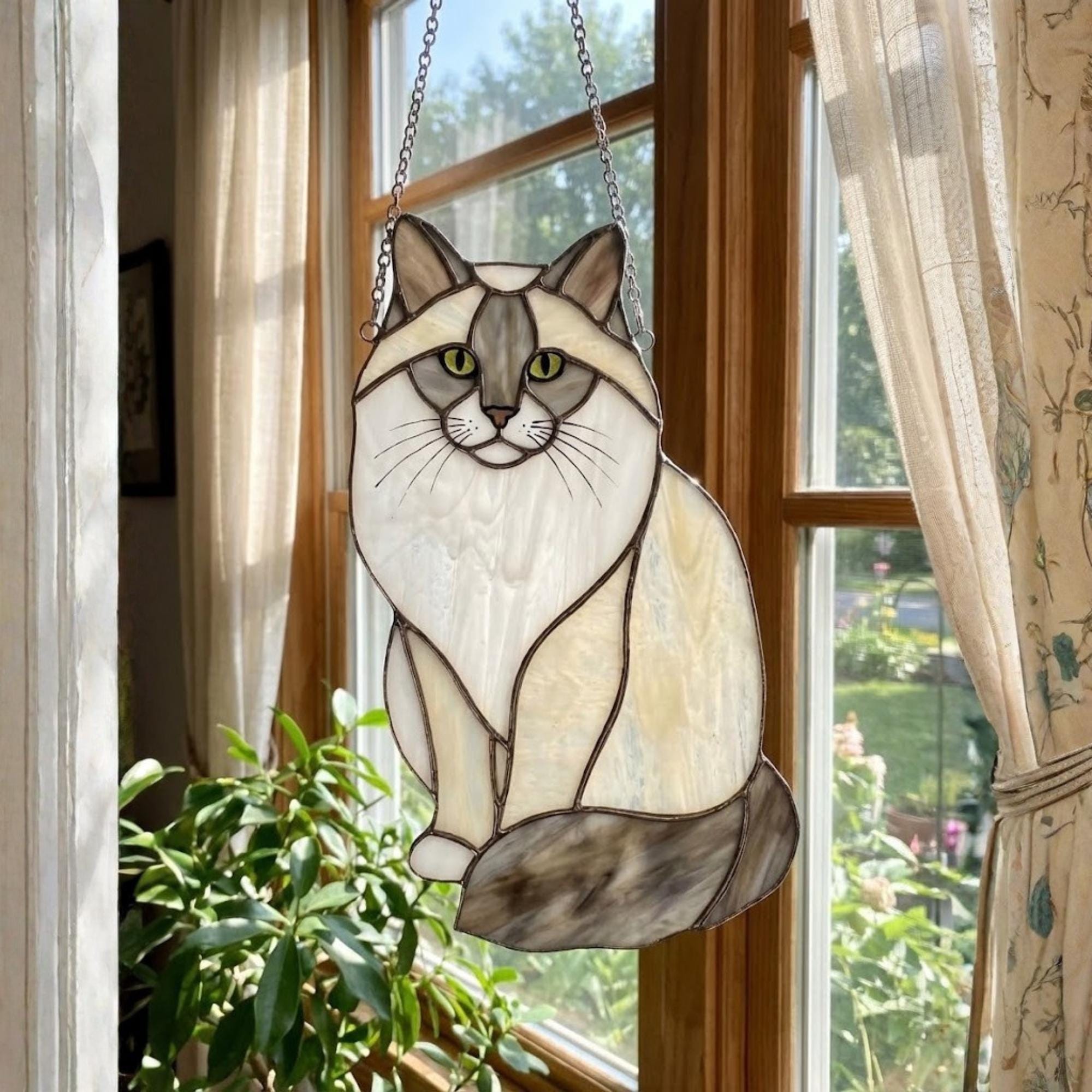 Himalayan or Balinese cat stained glass suncatcher with blue eyes.
