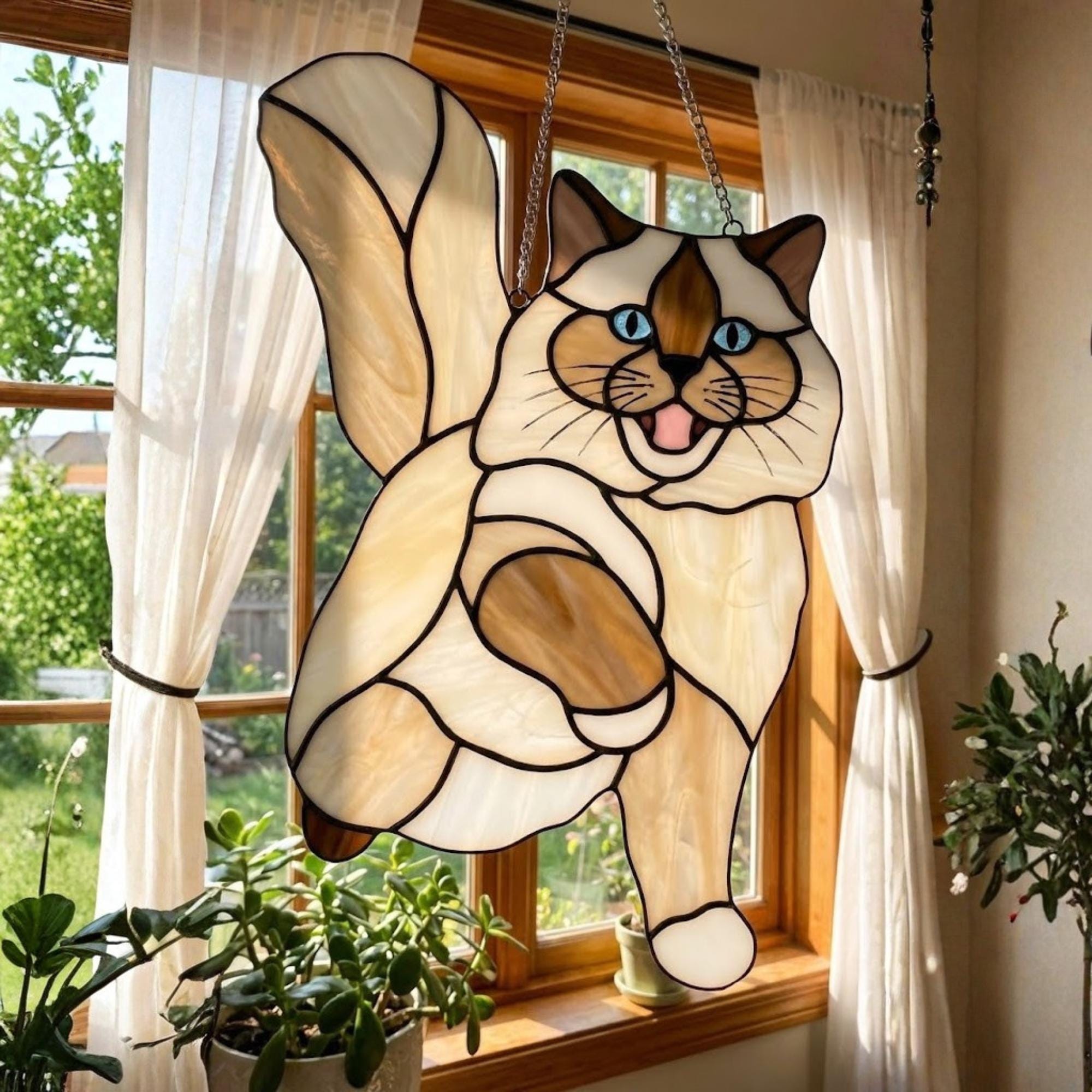 Playful Ragdoll cat with fluffy tail stained glass, cute kitty window decor.