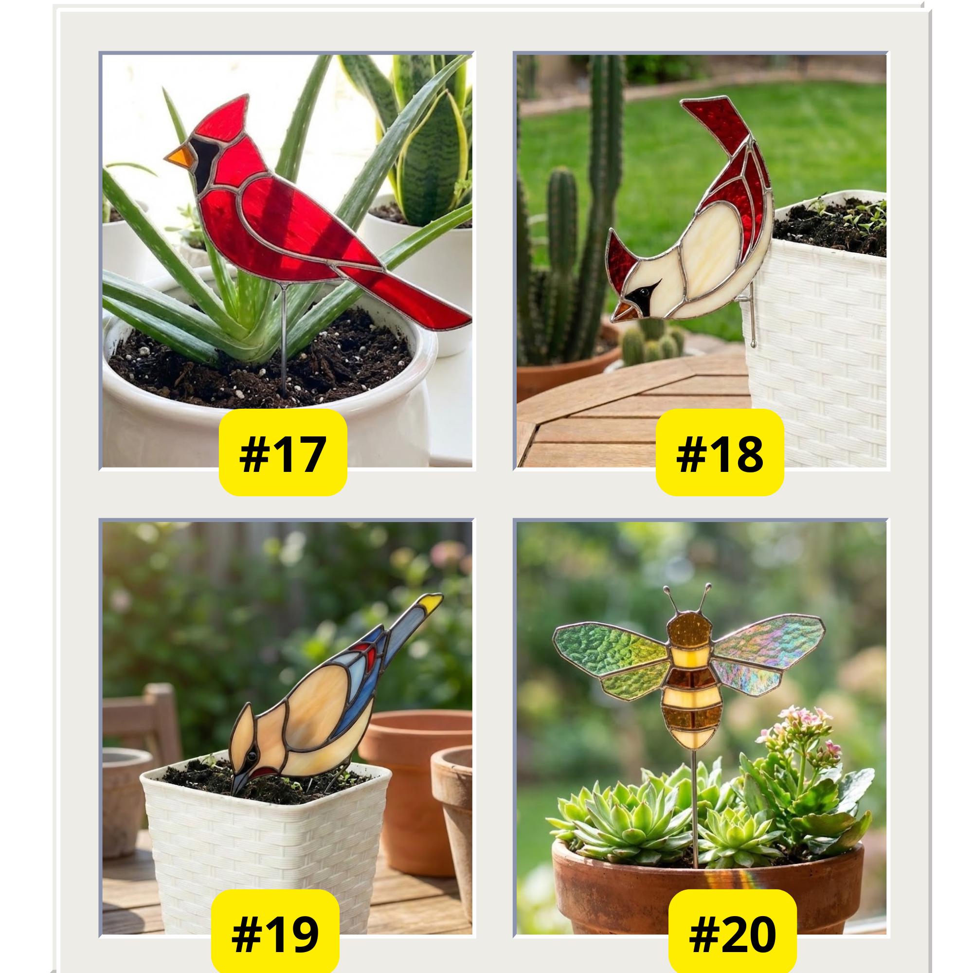 Vibrant stained glass butterfly plant stake with monarch orange and blue morpho wings patterns, inserted in indoor flower pot catching sunlight.