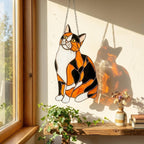 Stained glass Calico cat suncatcher with orange black and white patches, available in sitting and sleeping poses, window hanging or wood stand decor.