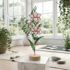 Stained glass birth month flower standing on wood base, personalized gift for mom, available in 12 monthly floral designs like rose iris and daffodil.