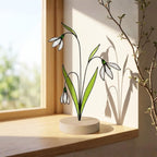 Stained glass snowdrop flower with white petals and green leaves, January birth month gift, available with personalized wood stand or as a single stem.