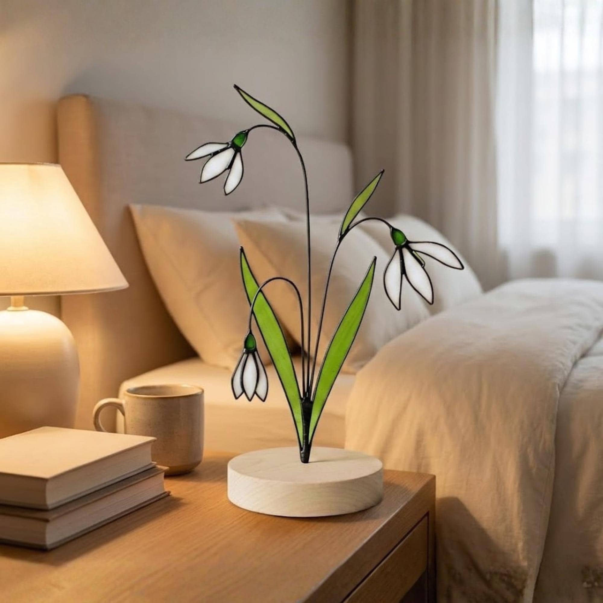 Stained glass snowdrop flower with white petals and green leaves, January birth month gift, available with personalized wood stand or as a single stem.