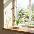 Stained glass snowdrop flower with white petals and green leaves, January birth month gift, available with personalized wood stand or as a single stem.