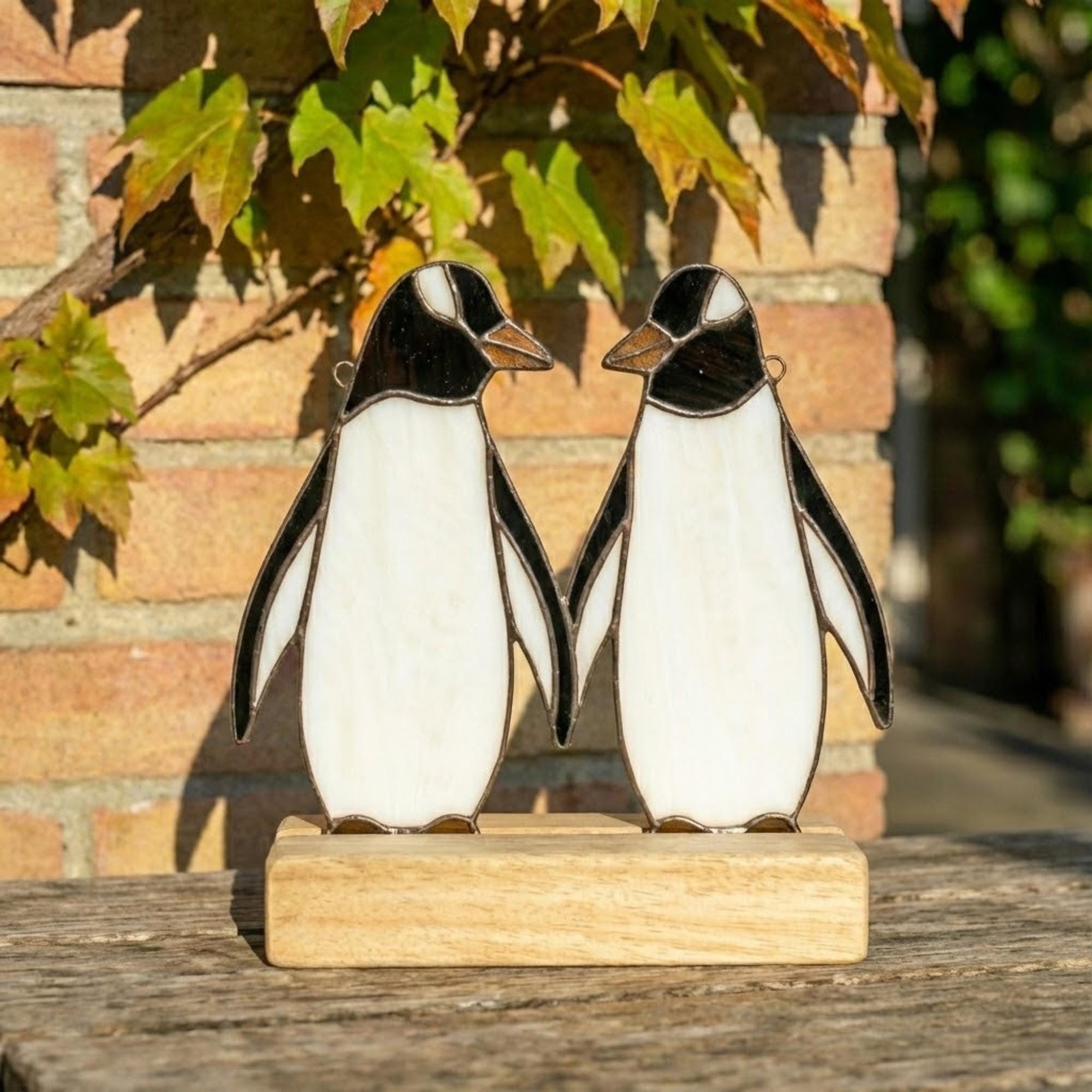Stained glass penguin couple holding hands, romantic valentines day gift for her, cute animal suncatcher on wood stand.