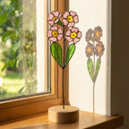 Stained glass pink primrose flower with yellow centers, February birth month gift, available with personalized wood stand or as a single stem.