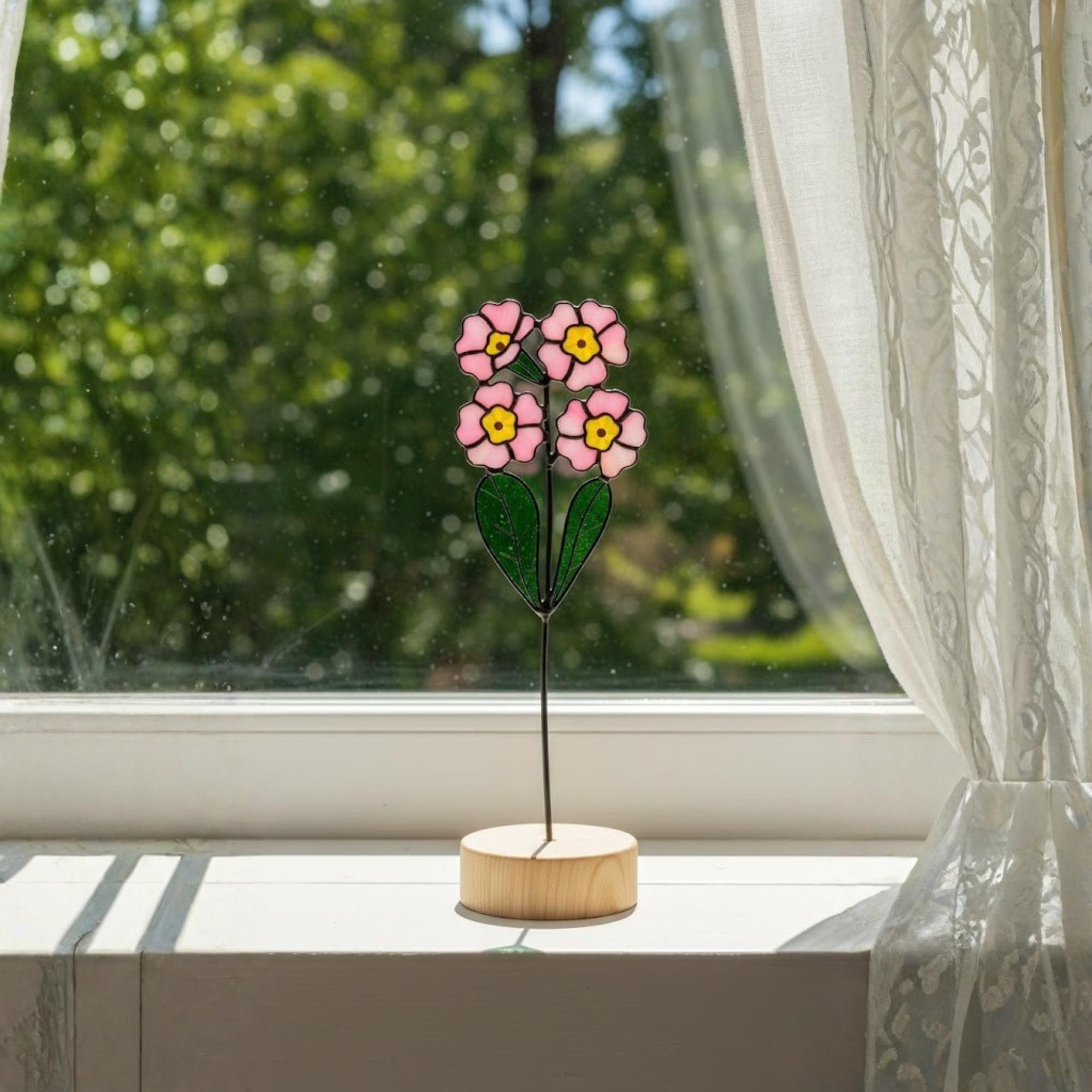 Stained glass pink primrose flower with yellow centers, February birth month gift, available with personalized wood stand or as a single stem.