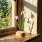 Stained glass birth month flower collection on wood stand, personalized family garden gift for mom, comprising 12 monthly floral designs like rose daisy and daffodil.