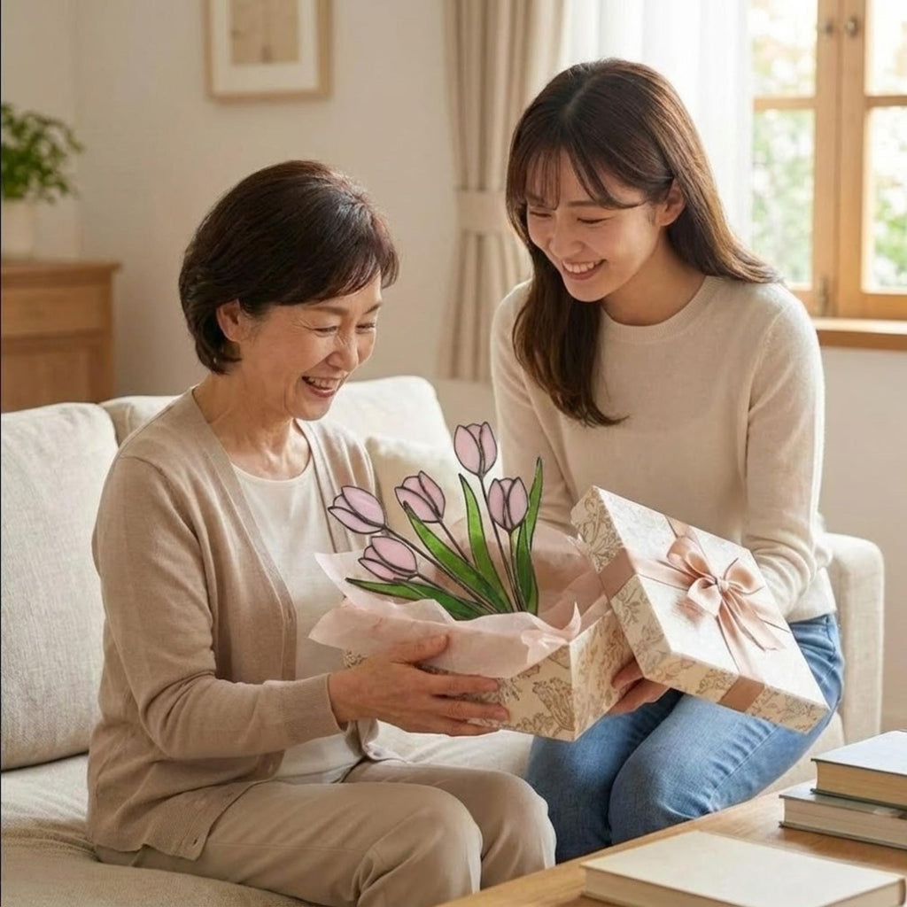 Pink stained glass tulip bouquet 3D flower stems held in hands as Mother's Day gift forever floral art casting colored shadows spring home decor handmade by LuzyGlassArt.