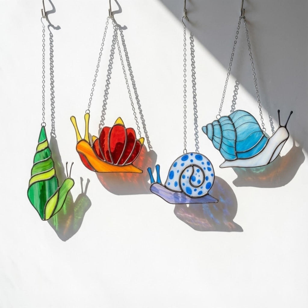 Cute stained glass snail suncatcher hanging on window, whimsical cottagecore decor for plant lovers, colorful glass animal art handmade in Vietnam, goblincore aesthetic gift.