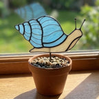 Cute stained glass snail suncatcher hanging on window, whimsical cottagecore decor for plant lovers, colorful glass animal art handmade in Vietnam, goblincore aesthetic gift.