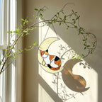 Stained glass sleeping cat on moon suncatcher window hanging, black orange tuxedo calico cat memorial gift for pet loss, handmade celestial decor by LuzyGlassArt.