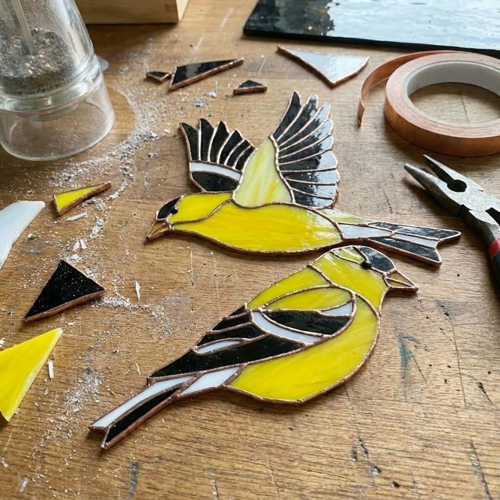 Stained glass American Goldfinch suncatcher hanging on window casting yellow shadows, vibrant yellow bird ornament for birdwatchers, handmade state bird gift for New Jersey Iowa Washington by LuzyGlassArt.