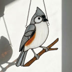 Stained glass Black-capped Chickadee bird suncatcher on branch hanging on window, handmade Maine and Massachusetts state bird gift, realistic nature decor by LuzyGlassArt.
