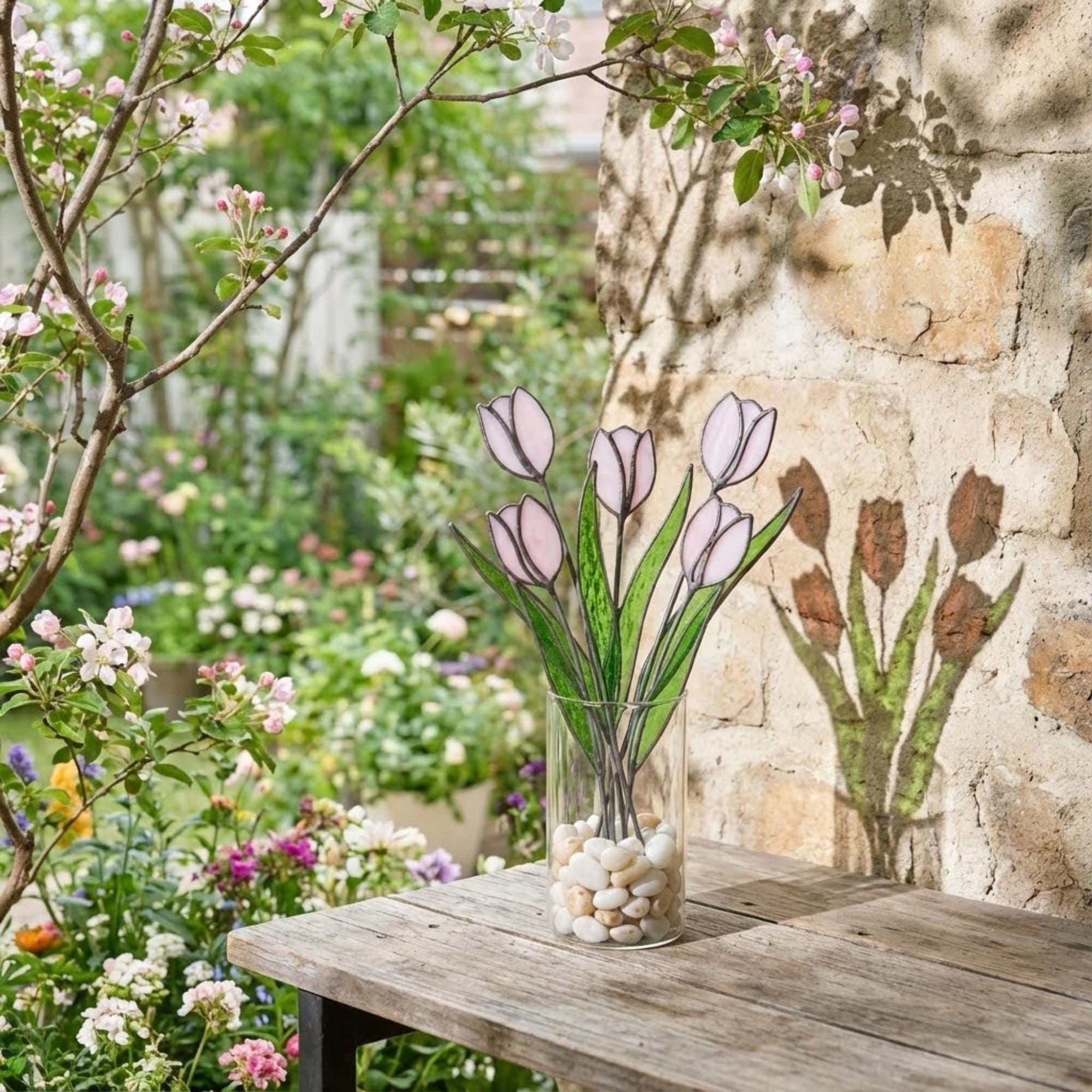 Pink stained glass tulip bouquet 3D flower stems held in hands as Mother's Day gift forever floral art casting colored shadows spring home decor handmade by LuzyGlassArt.