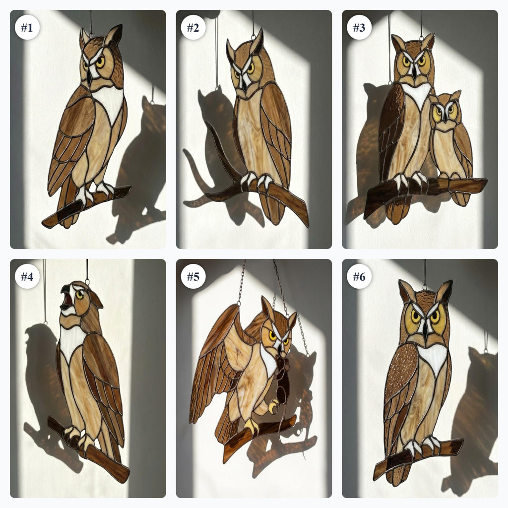 Handmade stained glass owl suncatcher in brown and beige tones, perched on a branch, casting warm amber shadows on a white wall, Tiffany style soldering detail.