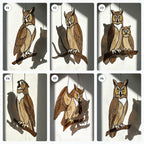 Handmade stained glass owl suncatcher in brown and beige tones, perched on a branch, casting warm amber shadows on a white wall, Tiffany style soldering detail.