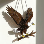 Handmade stained glass bald eagle suncatcher, realistic bird window hanging with brown and white glass, patriotic gift for dad or veteran, creating colored shadows.