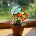Cute stained glass snail suncatcher hanging on window, whimsical cottagecore decor for plant lovers, colorful glass animal art handmade in Vietnam, goblincore aesthetic gift.