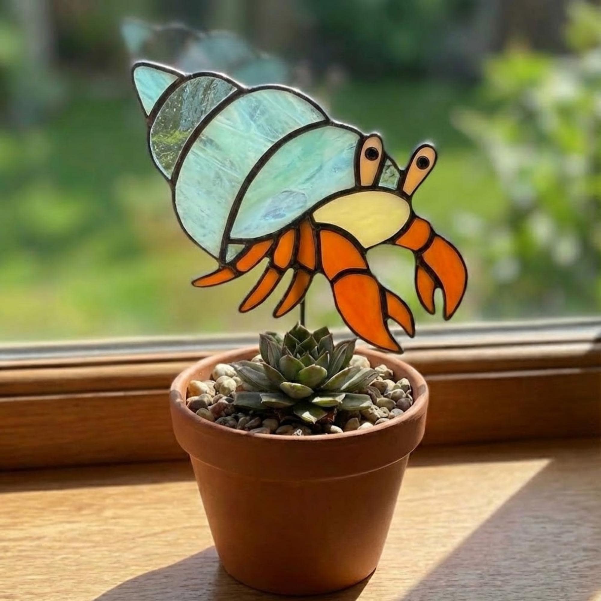 Cute stained glass snail suncatcher hanging on window, whimsical cottagecore decor for plant lovers, colorful glass animal art handmade in Vietnam, goblincore aesthetic gift.