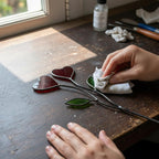 Colorful stained glass heart plant stakes with green leaves in a flower pot, gift box packaging, garden decor for plant lovers.