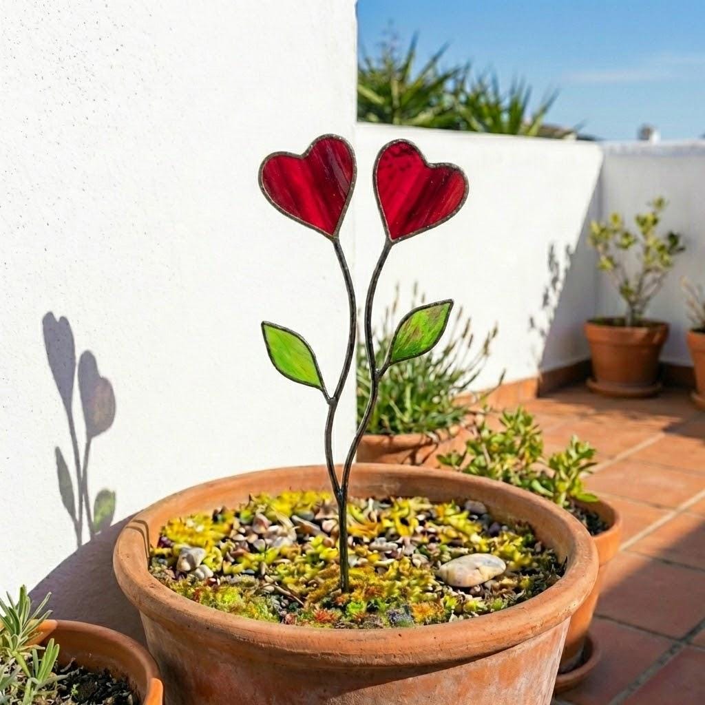 Colorful stained glass heart plant stakes with green leaves in a flower pot, gift box packaging, garden decor for plant lovers.