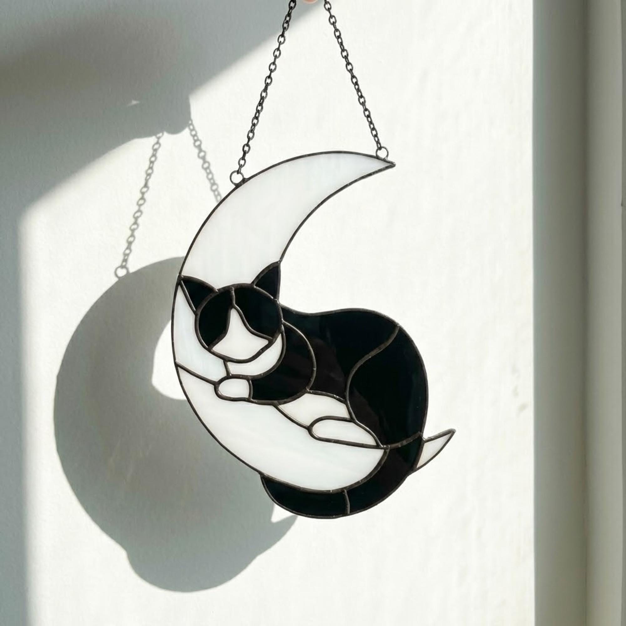 Stained glass sleeping cat on moon suncatcher window hanging, black orange tuxedo calico cat memorial gift for pet loss, handmade celestial decor by LuzyGlassArt.