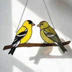 Stained glass American Goldfinch suncatcher hanging on window casting yellow shadows, vibrant yellow bird ornament for birdwatchers, handmade state bird gift for New Jersey Iowa Washington by LuzyGlassArt.