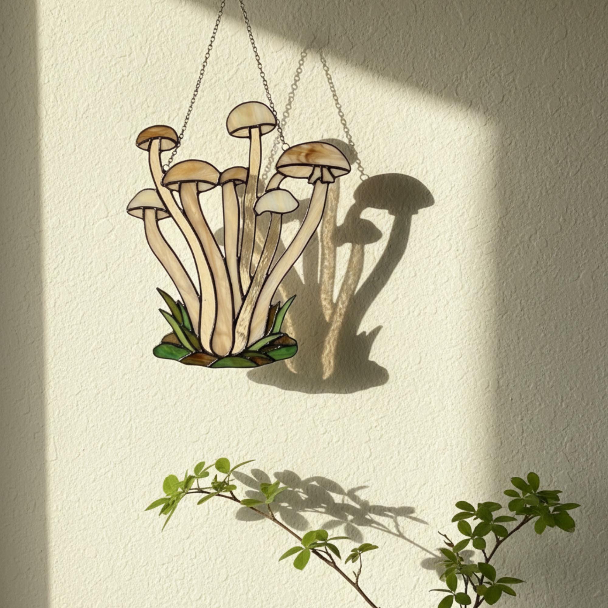 Handmade stained glass mushroom suncatcher with green grass base, colorful fungi window hanging, cottagecore forest decor for plant lovers.