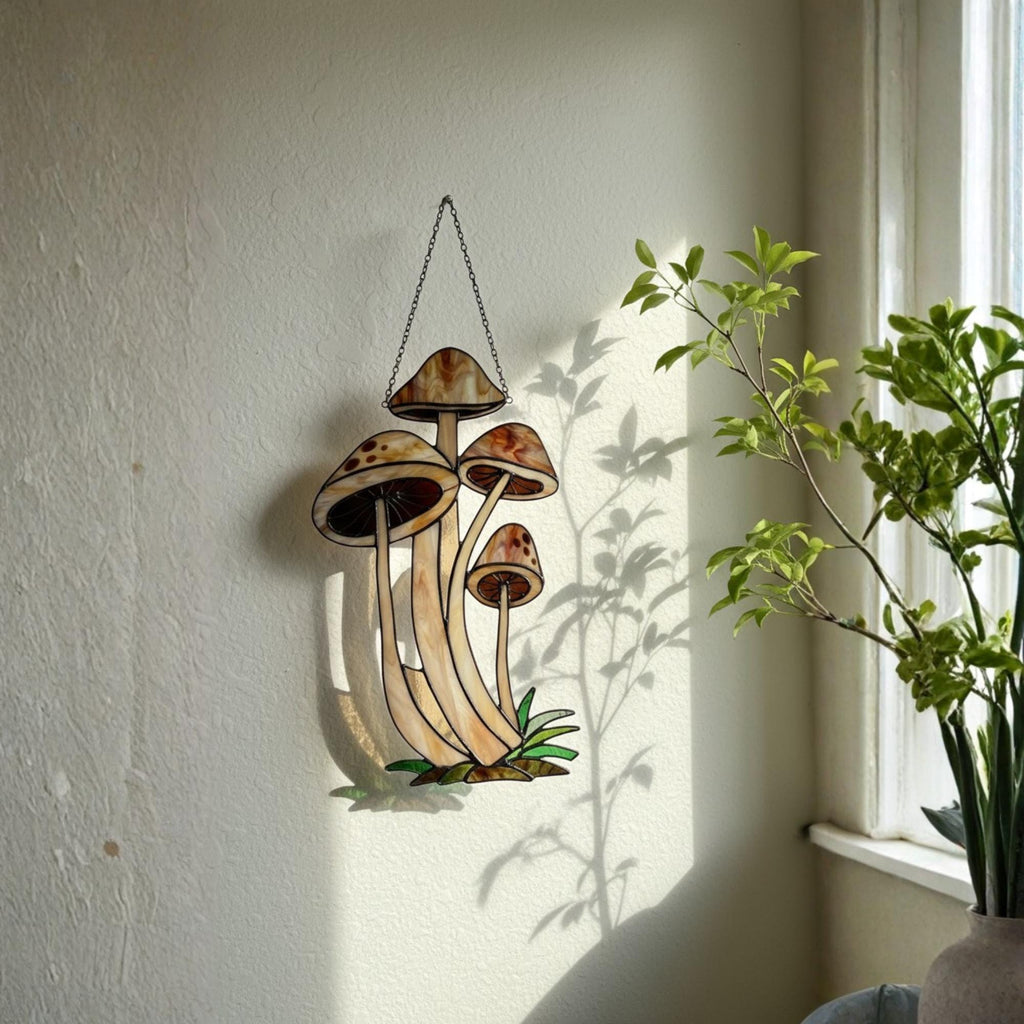 Handmade stained glass mushroom suncatcher with green grass base, colorful fungi window hanging, cottagecore forest decor for plant lovers.