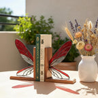Handmade dragonfly wing stained glass bookends on premium solid oak base, green and yellow glass casting shadows, art nouveau luxury decor.