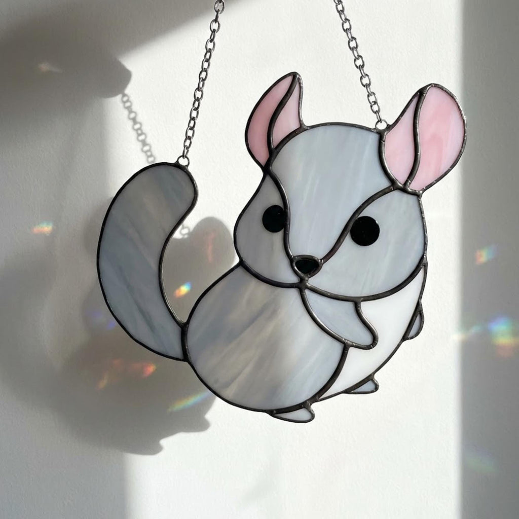 Handmade stained glass chinchilla suncatcher, cute white and grey rodent holding a branch, kawaii animal window hanging for pet lovers.