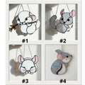 Handmade stained glass chinchilla suncatcher, cute white and grey rodent holding a branch, kawaii animal window hanging for pet lovers.