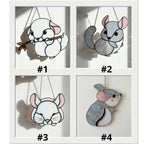 Handmade stained glass chinchilla suncatcher, cute white and grey rodent holding a branch, kawaii animal window hanging for pet lovers.