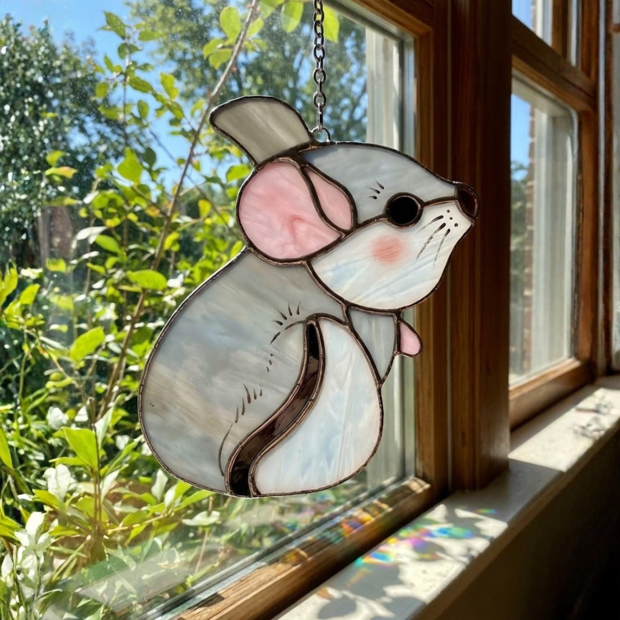 Handmade stained glass chinchilla suncatcher, cute white and grey rodent holding a branch, kawaii animal window hanging for pet lovers.