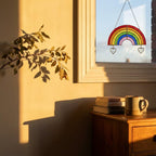 Handmade stained glass rainbow suncatcher with personalized wooden name tag, rainbow bridge pet memorial gift for dog or cat loss, hanging glass hearts.