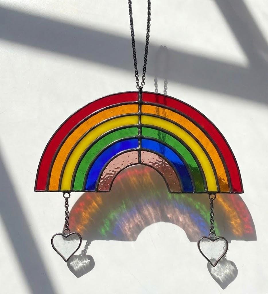 Handmade stained glass rainbow suncatcher with personalized wooden name tag, rainbow bridge pet memorial gift for dog or cat loss, hanging glass hearts.