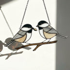Stained glass Black-capped Chickadee bird suncatcher on branch hanging on window, handmade Maine and Massachusetts state bird gift, realistic nature decor by LuzyGlassArt.