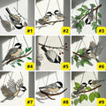 Stained glass Black-capped Chickadee bird suncatcher on branch hanging on window, handmade Maine and Massachusetts state bird gift, realistic nature decor by LuzyGlassArt.